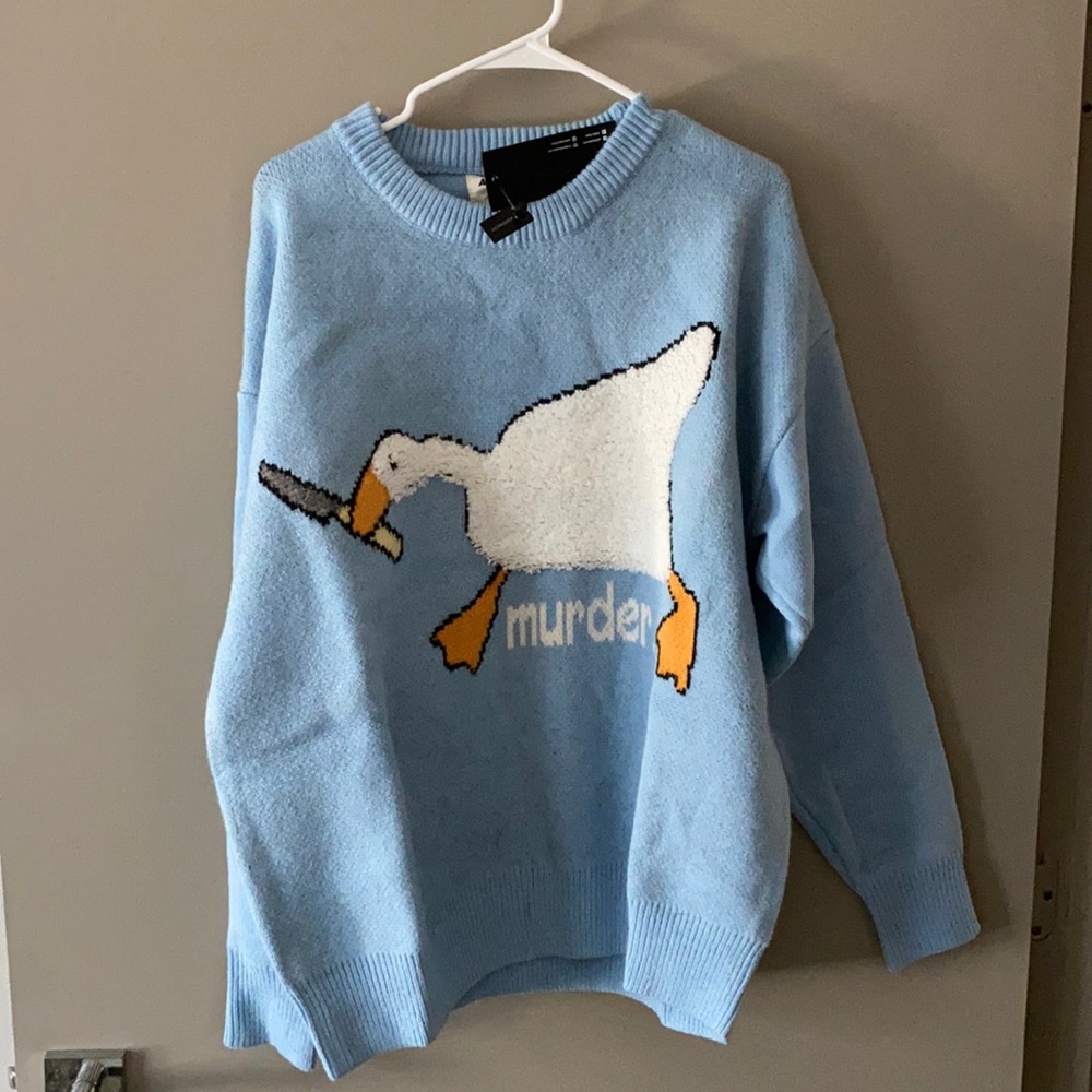 Blue knit sweater with goose design